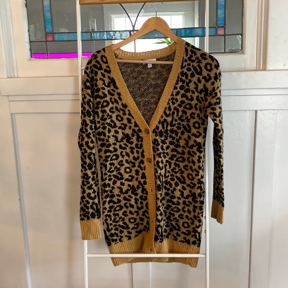 Bound animal print long sleeve sweater with button